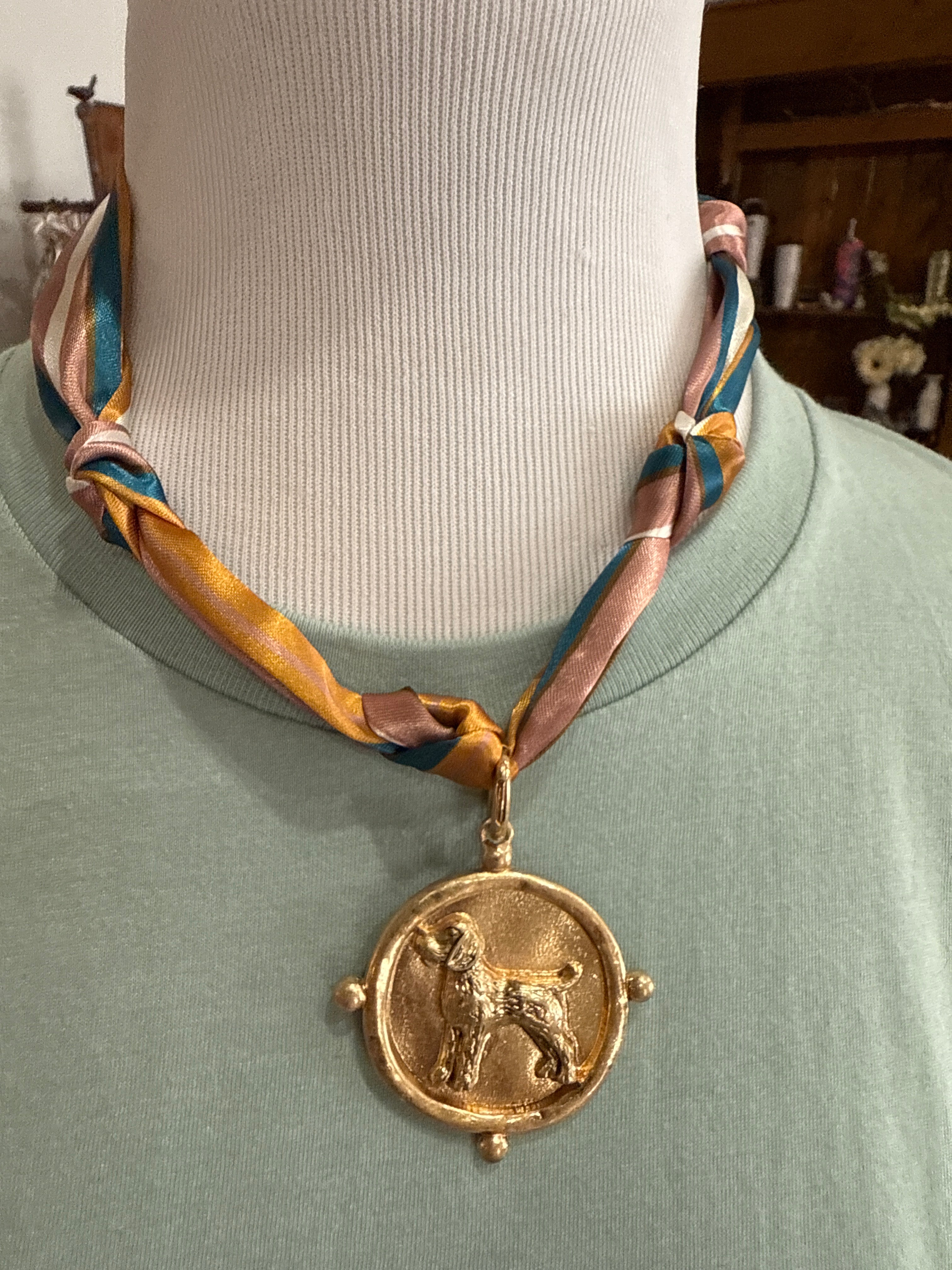 Scarf with dog pendant